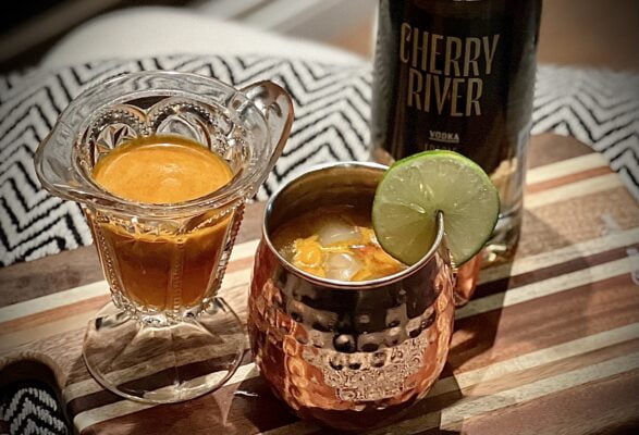Mulled Seaberry Moscow Mule with Cherry River Maple Vodka in a copper cup