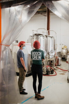 Two members of the Booch Organic Kombucha Crew in the Brew Room